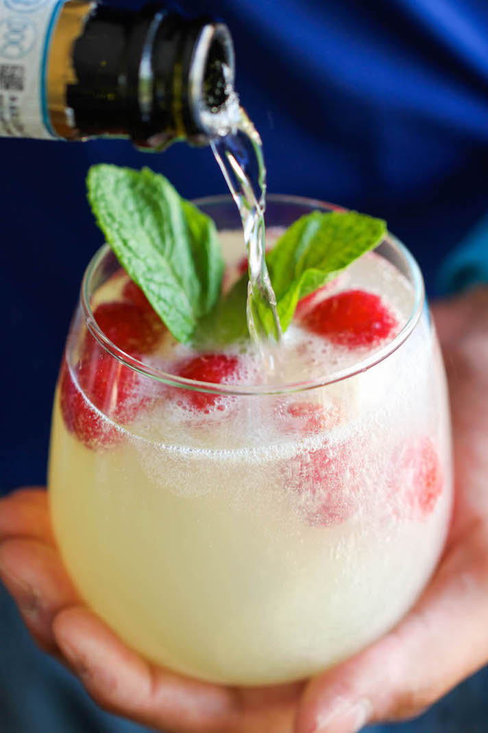 STYLECASTER | 11 Champagne Punch Recipes That'll Make Any Party More Fun | Raspberry Limoncello Prosecco Punch
