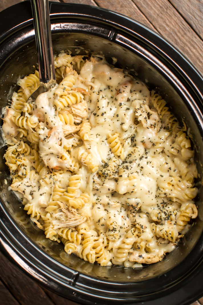STYLECASTER | Slow-Cooker Pastas Are the Easiest Way to Indulge in a Lazy, Decadent Meal This Summer | Pesto Chicken Mozzarella Pasta