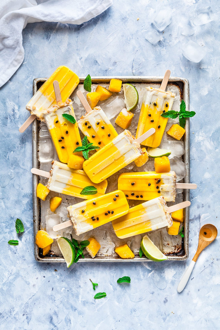 STYLECASTER | 17 DIY Popsicles To Make With All That Summer Fruit | Mango, Passionfruit, and Coconut Macadamia Popsicles