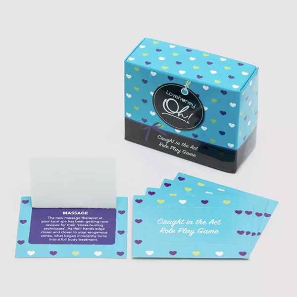 A stack of role play prompts in front of a card box