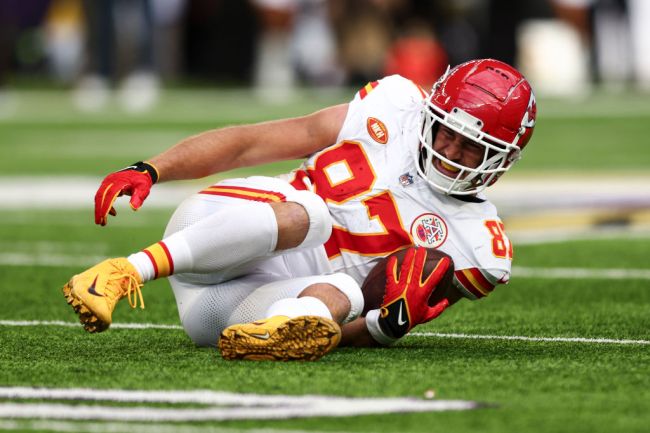Travis Kelce of the Kansas City Chiefs winces in pain after sustaining an injury  against the Minnesota Vikings