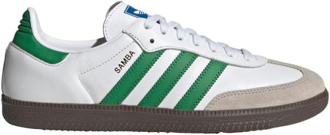 A white Adidas sneaker with green stripes