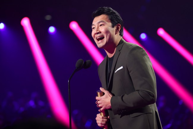 Simu Liu accepting an award at the People's Choice Awards in 2021.