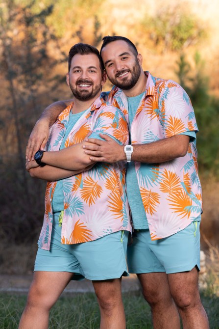 Ricky Rotandi and Cesar Aldrete, two white men in Hawaiian shirts and blue shorts.