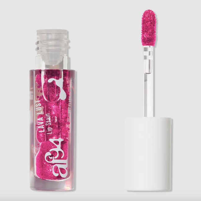 A hot pink colored lip stain that resembles a lava lamp in a clear bottle.