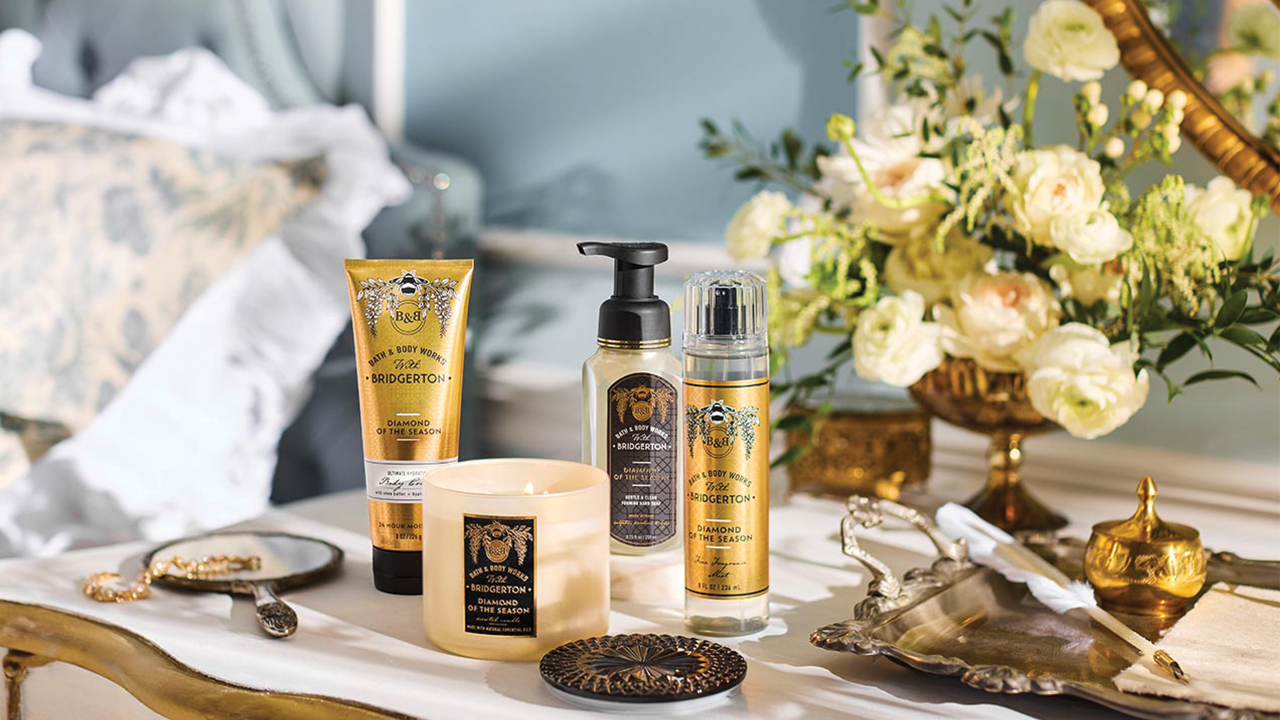 Bath & Body Works x Bridgerton collection: a gold candle, body lotion, hand soap, and body spray.