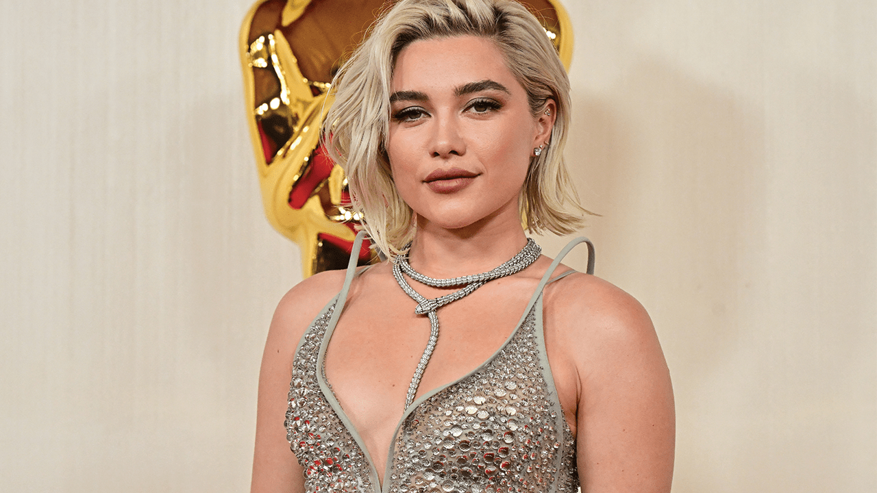 Florence Pugh wearing a silver dress.