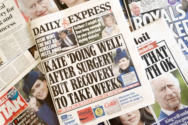 Photo of newspaper front pages about Kate Middleton's mysterious abdominal surgery. One reads: Kate 'Doing Well' After Surgery But Reovery Could Take Weeks