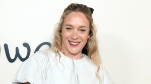 Chloë Sevigny wearing a white bubble dress and a black hair bow.