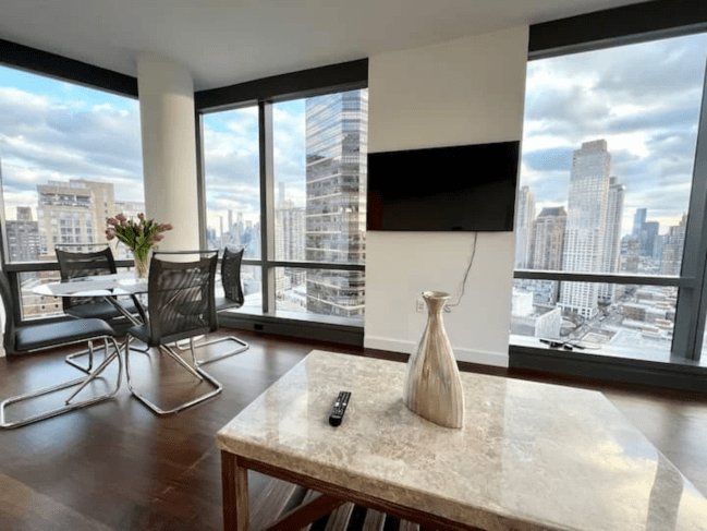 High-up NYC Airbnb apartment with beautiful skyline and river views of the city.