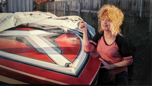 Roberts Holliday (played by Morgana Shaw) in Hit Man with Glen Powell