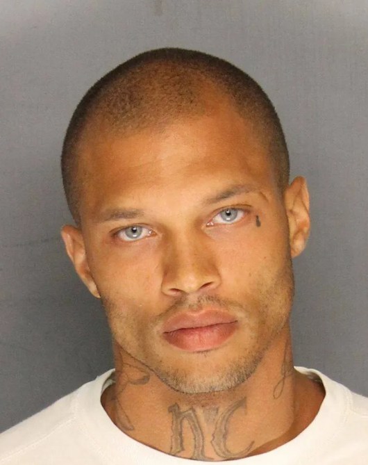Mugshot of model Jeremy Meeks with a grey background.