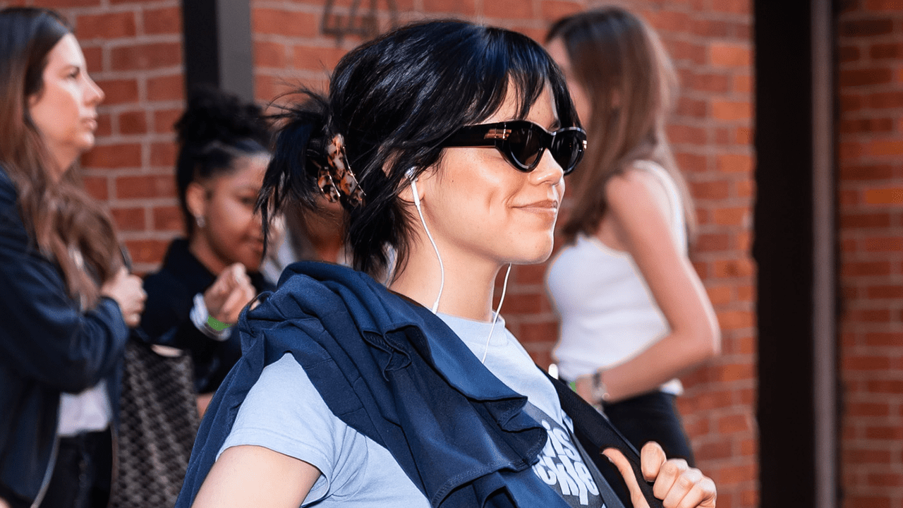 Jenna Ortega wearing black sunglasses.