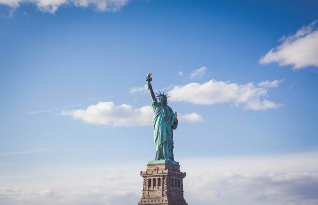 The Statue of Liberty in front of a blue sky