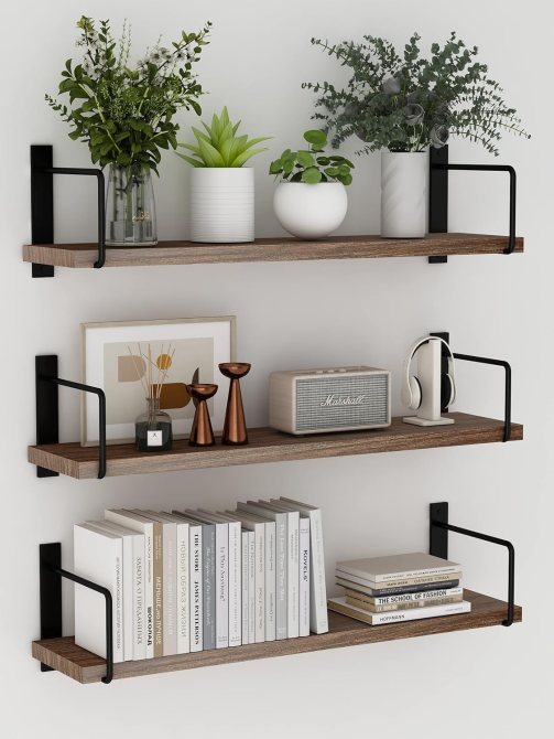 Three wooden shelves with various items on them