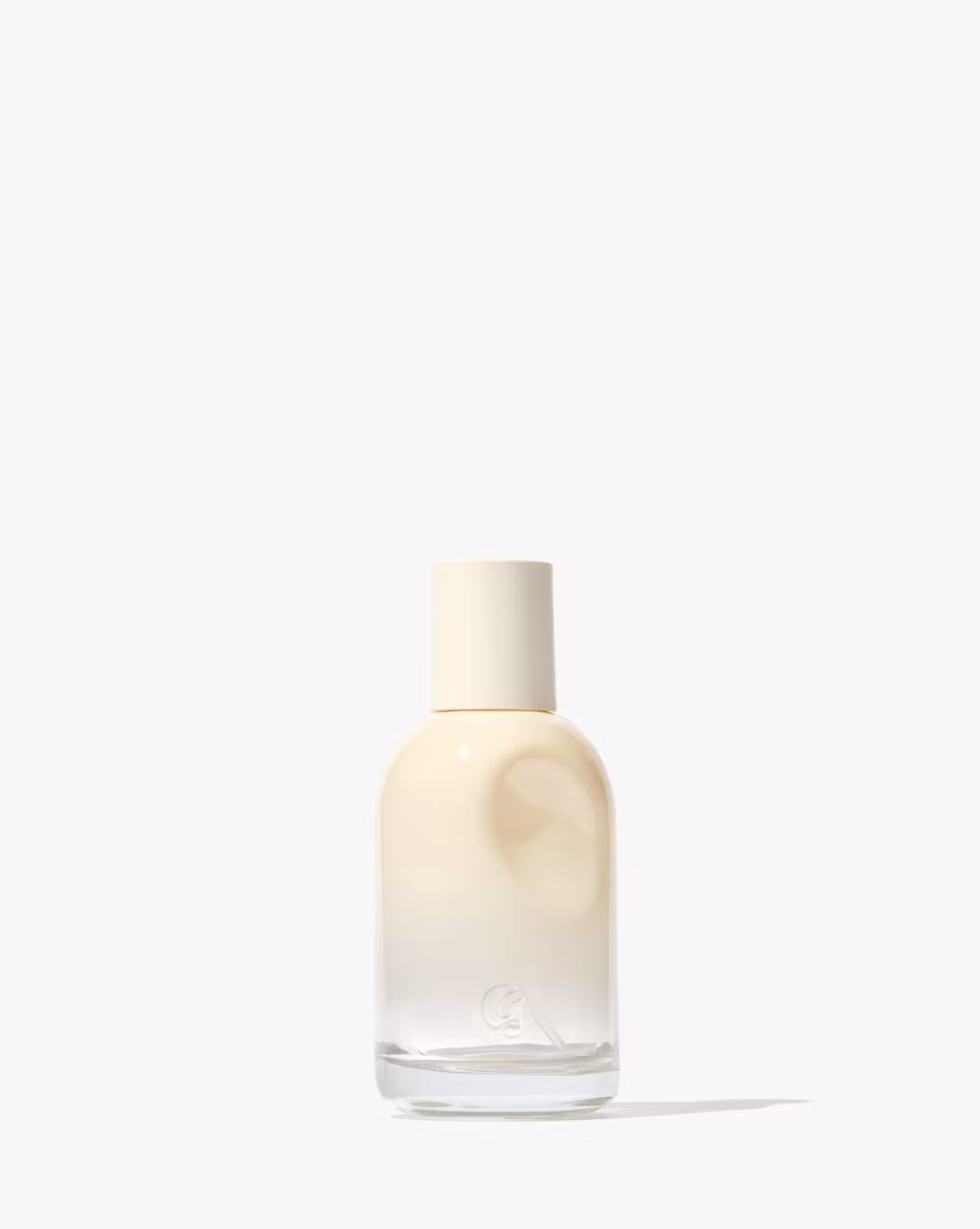 Glossier You Doux in an ivory bottle.