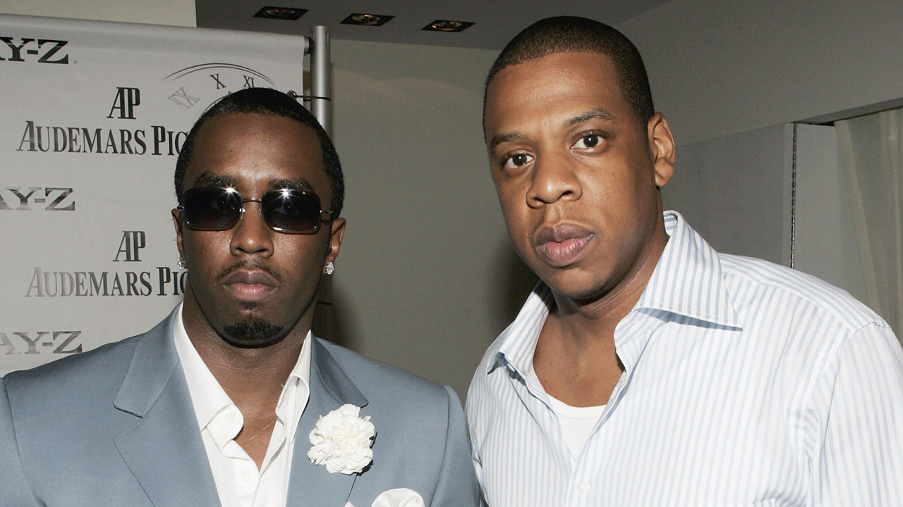 Rappers/producers Jay-Z (R) and Sean "P. Diddy" Combs attend the Launch Party for Jay-Z's Limited Edition Audemars Piguet watches and iPods at Audemars Piguet Boutique on June 7, 2005 in New York City.