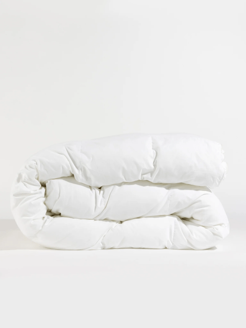 A folded white comforter