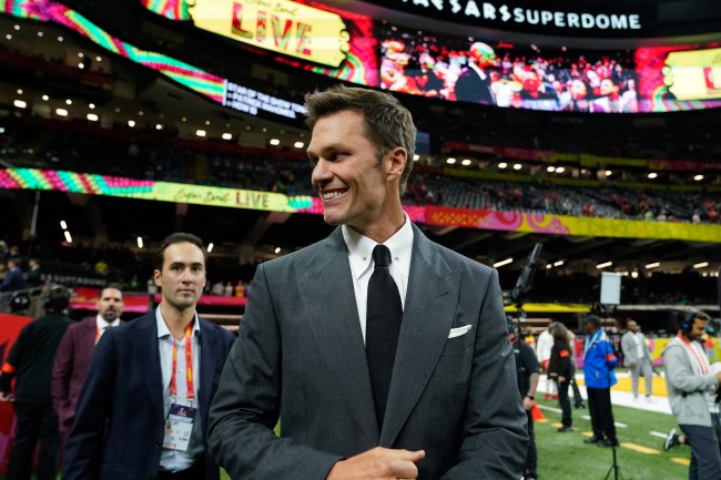 Retired football player and Fox analyst Tom Brady walks the sidelines before the start of Super Bowl LIX between the Kansas City Chiefs and the Philadelphia Eagles at Caesars Superdome in New Orleans, Louisiana, February 9, 2025.