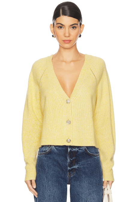 A model wearing the ba&sh Carila Cardigan in a butter-canary yellow colroway