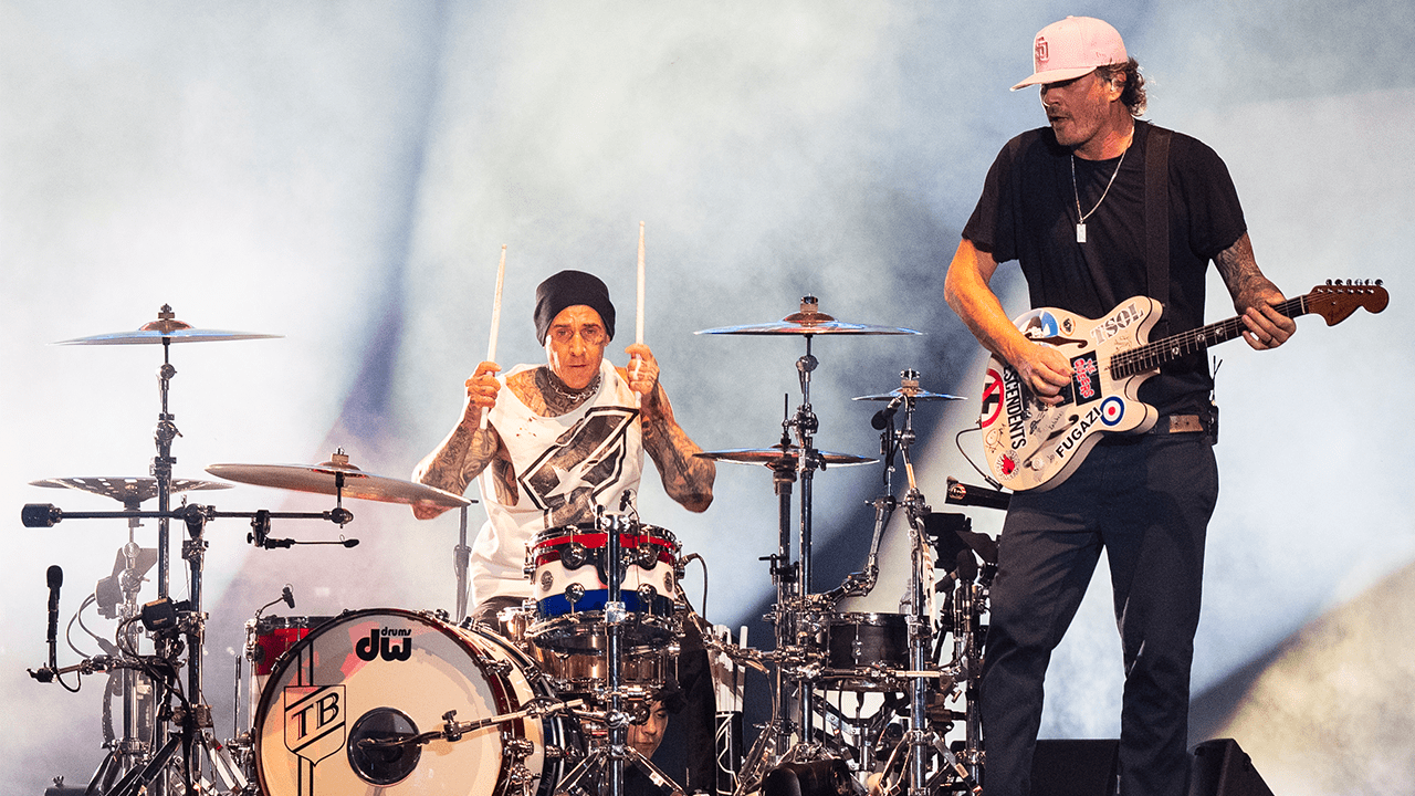 CHICAGO, ILLINOIS - AUGUST 04: (L-R) Travis Barker and Tom DeLonge of Blink-182 perform during 2024 Lollapalooza Festival at Grant Park on August 04, 2024 in Chicago, Illinois.