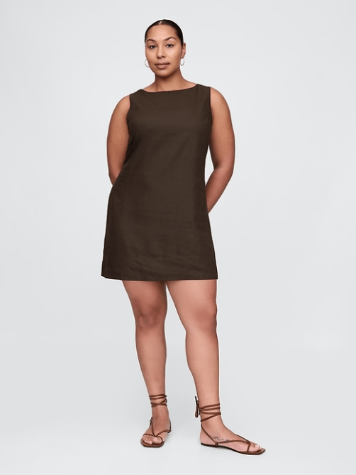 A model wearing the GAP Linen-Blend Mini Shift Dress in dark brown