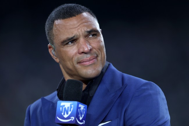 EAST RUTHERFORD, NEW JERSEY - SEPTEMBER 26: Sports analyst Tony Gonzalez  talks prior to the game between the New York Giants and the Dallas Cowboys at MetLife Stadium on September 26, 2024 in East Rutherford, New Jersey.