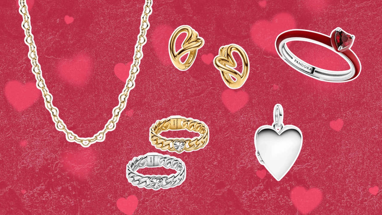 A red background with hearts featuring a heart-shaped gold chain necklace, red enamel heart ring, heart-shaped hoop earrings, a silver heart locket, and a set of two chain bands with a heart stone center.