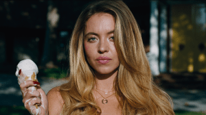 Sydney Sweeney's character holding a melting ice cream cone and staring into the camera, in Euphoria Season 3